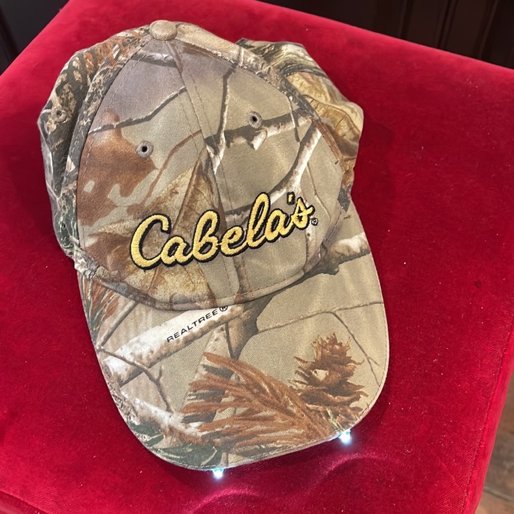 Cabela’s camo LED baseball cap with independent white and green LEDs